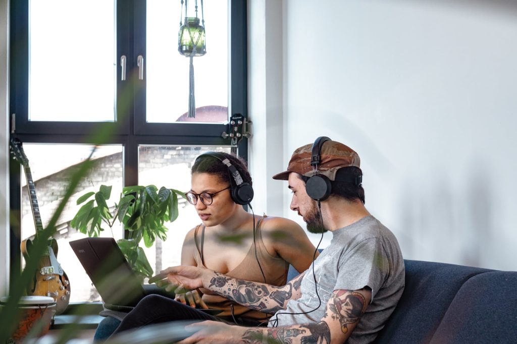 BIMM Berlin music business students listening on headphones