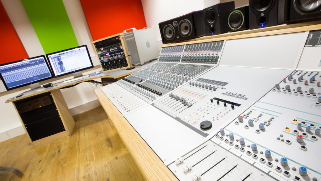 Sound board and mixing station in a studio