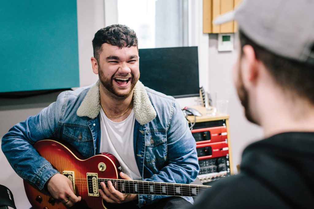 BIMM Manchester student with guitar