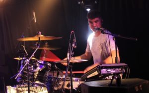 BIMM Review: Diploma Showcase - student on stage playing the drums