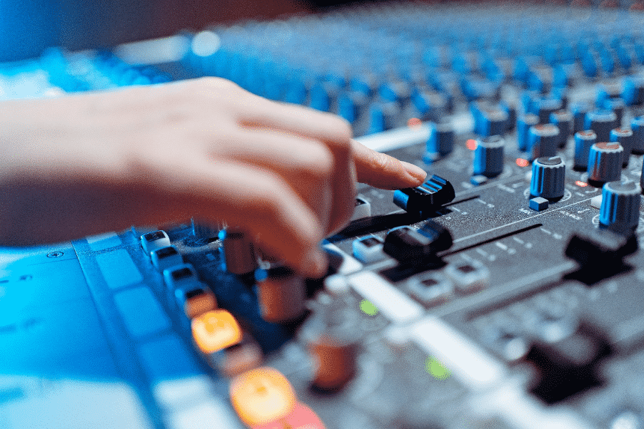 A music production student uses the studio