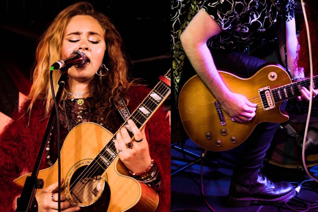 Leah Wilcox playing guitar on stage