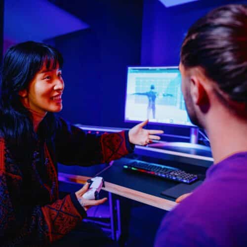 MA Music for Film Games and Media lecturer speaking with student