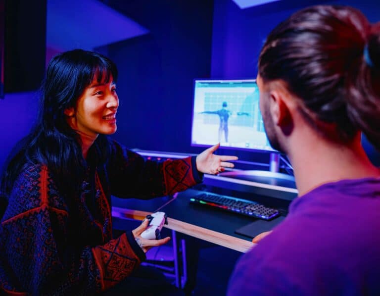 MA Music for Film Games and Media lecturer speaking with student